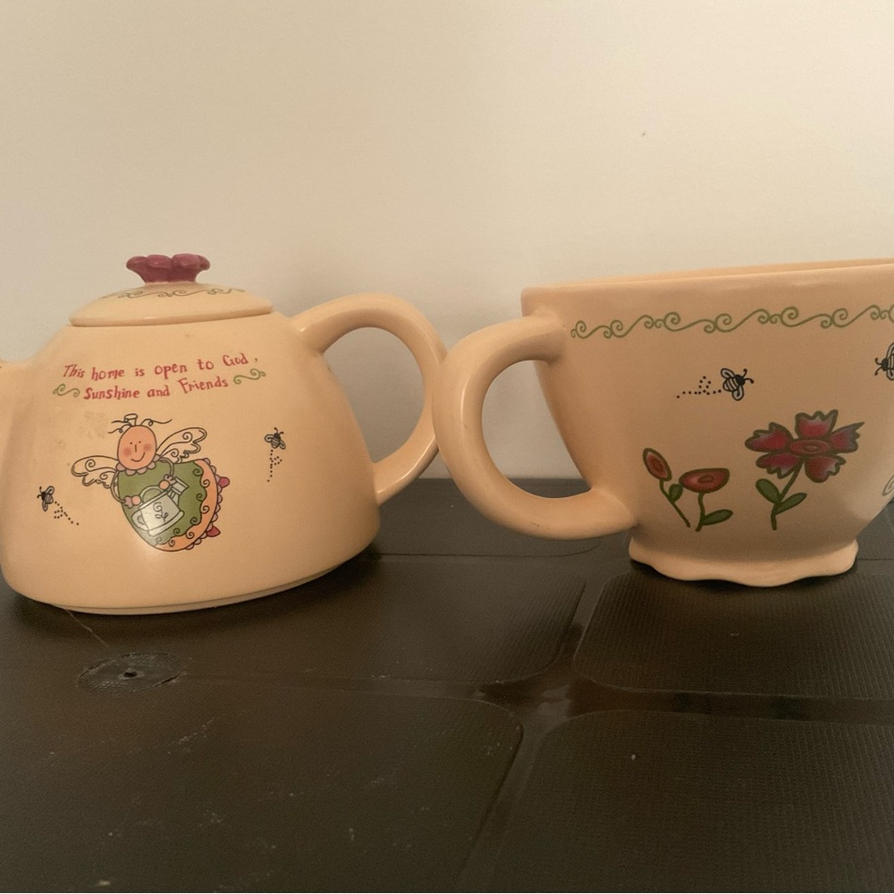 Adorable matching Teapot sits on matching teacup, “Sunshine & Friends”
New